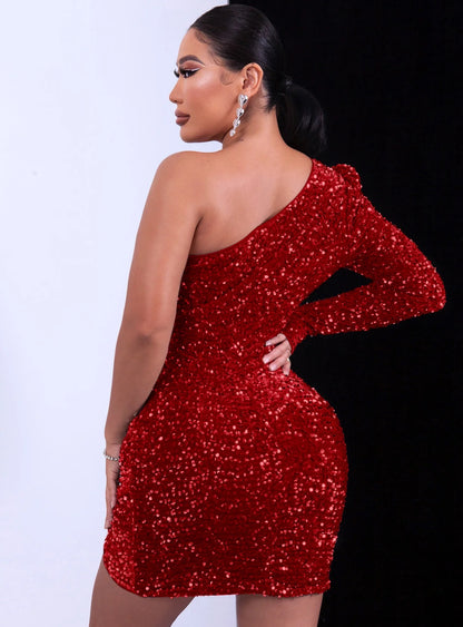 Woman wearing a red glitter sequin one-shoulder dress 